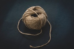 brown wool yarn ball isolated on dark background. ball of yarn for knitting