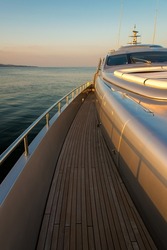 Beautiful sea view from the left board of a luxury yacht at sunset ,  sunrise - vertical orientation