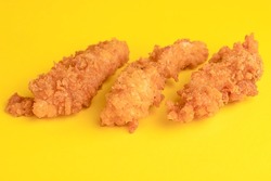 Chicken strips, chicken strips on yellow background, bright background