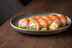 Philadelphia roll sushi with salmon, prawn, avocado, cream cheese. Sushi menu.