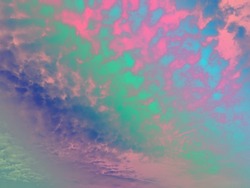beauty sweet pastel green pink colorful with fluffy clouds on sky. multi color rainbow image. abstract fantasy growing aurora light