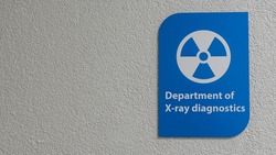 A sign of radiation danger. X-ray room in a medical clinic. Space for text. Warning about the effects of radiation. Medical textured.