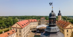 Aerial view of spire of the castle tower of Nesvizh Castle, Belarus. Medieval castle and palace. Heritage concepts. Restored medieval fortress. World monument of architecture.