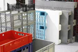 Large plastic boxes. Industrial size plastic containers. Large plastic boxes in the warehouse.