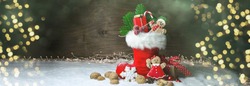 Filled Nicholas boot with gift and gingerbread man - Christmas background with golden bokeh lights