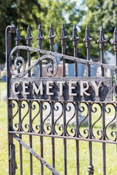 Black, wrought iron cemetery gate.