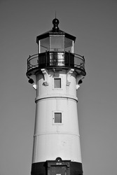 A vertical grayscale shot of a decorative lighthouse