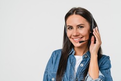 Closeup cropped of young friendly caucasian woman IT support customer support agent hotline helpline worker in headset looking at camera while assisting customer client isolated in white background