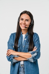 Vertical portrait of young friendly caucasian woman IT support customer support agent hotline helpline worker in headset looking at camera while assisting customer client isolated in white background