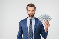 Prosperity wealth rich caucasian businessman ceo millionaire in formalwear suit holding money, buying expensive goods looking at camera isolated in white background