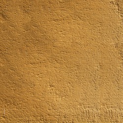 Yellow textured wall Gold colored textured blank wall.