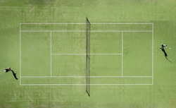 aerial view of two tennis players on an artificial grass court during a championship