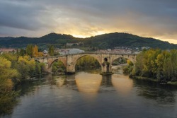 Roman Bridge of Ourense in a sunset with a spectacular light