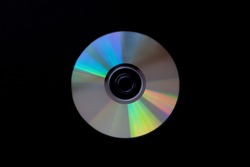 cd compact disc on dark black background top view  with copy space  close-up