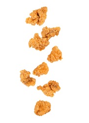 Falling of fried popcorn chicken isolated on white background.