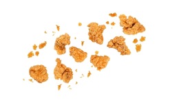 Fried popcorn chicken falling in the air isolated on white background.