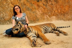 woman with Kanchanaburi temple tour tiger thailand