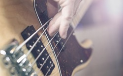 Bass guitar player closeup