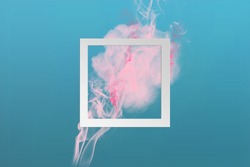 Soft pink color paint smoke explosion with square frame on classic blue to cyan gradient background. Creative minimal design composition with copy space.