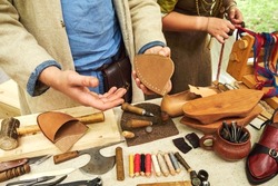 Making medieval vintage leather shoes, items for creating retro boots. Reconstruction of the events of the Middle Ages in Europe.