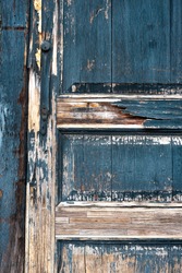 old vintage wood door peeling blue paint bare wood weathered textured background