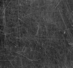 Scratched glass surface. Black and white.