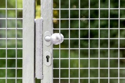 Gate Handle close up.Handle of Garden Fence Door,  Stainless Steel Gate to Garden.