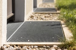 French drain, Gutter drain grate, Drain Grid in Front of Door. Floor drains - sewer cover. Stainless Grate of water Drain in front of Entrance Door.