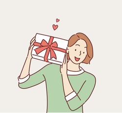 Happy smiling woman holding gift box. Hand drawn style vector design illustrations.