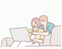 Beautiful young couple is using a laptop, hugging and smiling while sitting on couch at home. Hand drawn style vector design illustrations.