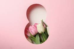 Paper cut Eight made of pink background and tulips on white background