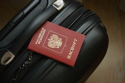 Russian passport on a suitcase for travel. an identity document. Russian Federation
