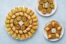 Traditional turkish, arabic dessert baklava assortment with pistachio. Ramadan sweets. Top view, copy space