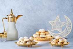   Assorted semolina maamoul or mamoul cookies with dallah and ramadan decor. Traditional arabic Eid al Adha, Eid al Fitr sweets                              