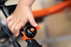 Kid ringing a bike bell