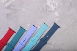 silicone straps for smart watches on a stone background. Flat lay with copyspace