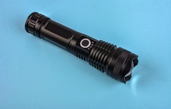 Black electric pocket flashlight, isolated on white .Black modern LED tactical flashlight isolated on white background
