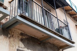 reconstruction of the balcony. metal structure to strengthen dilapidated balcony. High quality photo
