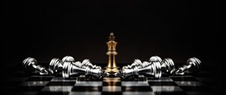 King chess pieces stand on falling chess concepts of competition challenge of leader business team or teamwork volunteer or wining and leadership strategic plan and risk management or team player.