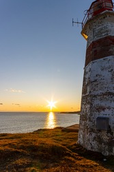 Musquash Head Lighthouse sunset in November 2019. New Brunswick Canada - Saint John region. Wide angle 