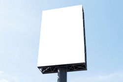 Outdoor pole billboard on blue sky background with mock up white screen and clipping path