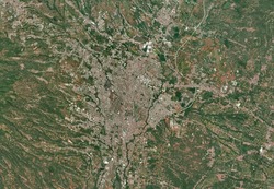 City of Malang from space. It shows region of Malang City in East Java Province, Indonesia. Source from satellite imagery. Suitable for background or wallpaper.