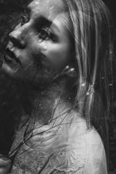 Black and white double exposure of young woman 