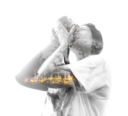Double exposure image of woman holding camera and nature background
