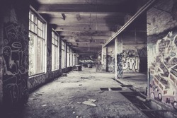 Old abandoned factory hall and graffiti