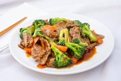 A view of a Chinese plate of beef and broccoli.