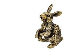 Hare Rabbit Vintage Antique grunge bronze brass figurine statue of beautiful animal on amber stand, isolated on white. Decoration Sculpture for interior. Copy Space for Text. Selective soft focus
