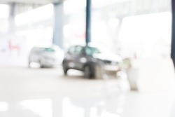Abstract blur of car in the showroom background