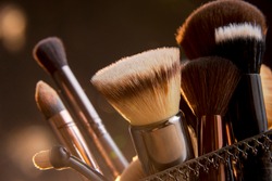 Close up photo of Makeup brushes with Bokeh