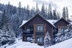 wooden houses in winter mountains, ski resort